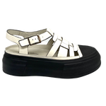Here's a cool pair of shoes that your feet will love to wear. These are part fisherman sandals and part sneakers.  They have a black rubber sole and toe cap and soft patent leather upper. You won't be disappointed in these babies.  Django & Juliette