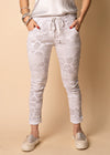 Elevate your summer wardrobe with the timeless elegance of our White Callow Pants. The clean canvas of white is complemented by the playful animal print, forming a harmonious balance between sophistication and trendiness. These stretchy full-length pants not only make a visual impact but also provide day-long comfort, thanks to the convenient drawstring waist and elastic band.  Material - Naturally derived viscose.  Designed In Australia