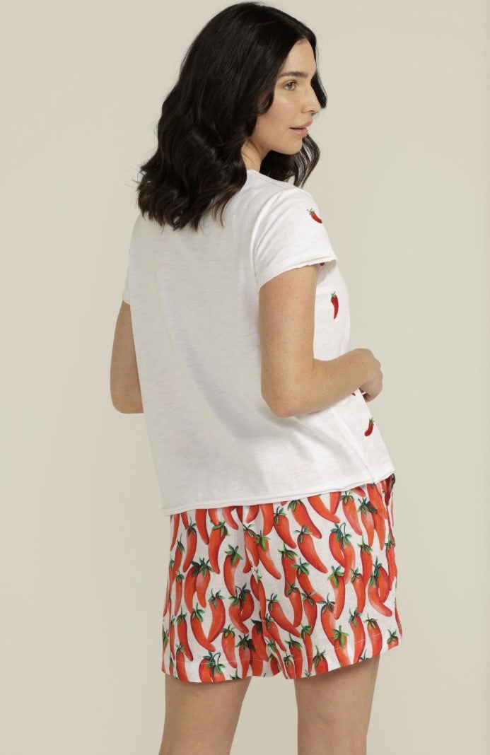 A fun 100% linen in chilli print fabric is used in these cute elasticised and drawstring waisted shorts. Pockets have also been included. Wear with our matching button through shirt or chose from our white tee with chilli embroidery or our striped tees in green. There is also a white knitted top or plain red linen shirt if that's more your style.