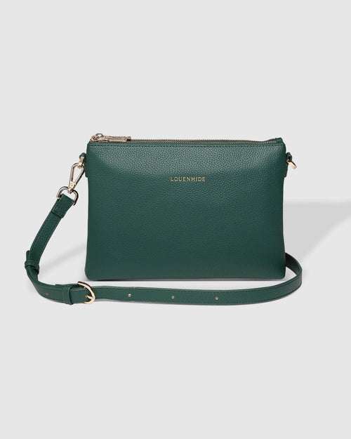 The Louenhide Millie Green Crossbody Bag is a timeless and functional everyday bag, designed to keep you organised and stylish throughout your day. Divided into two functional compartments, this casual crossbody bag provides the perfect solution for keeping your essentials neatly organised. Finished in a smooth vegan leather exterior, this women's crossbody bag is ready to withstand daily wear and tear, ensuring it remains a reliable companion.