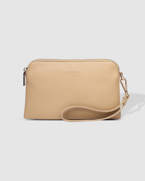 The Louenhide Poppy Clutch strikes the perfect balance between minimalism, versatility and style. She’s the ideal addition to your tote as a sleek clutch wallet or the perfect grab-and-go companion when carried by the wristlet. Designed in winter neutral soft-to-touch vegan leather, your essentials are organised in the backside pocket while held safe with the secure zip closures. Never go without your essentials and easily adapt to every occasion with the Poppy Clutch.