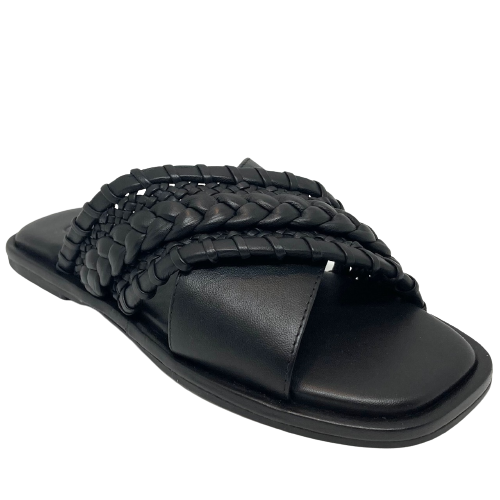 This classic little flat slide differs from the usual by having one of the wide cross over straps plain leather and the other a combination of plaiting, whip stitching and weaving of the leather. A great wardrobe "go to".