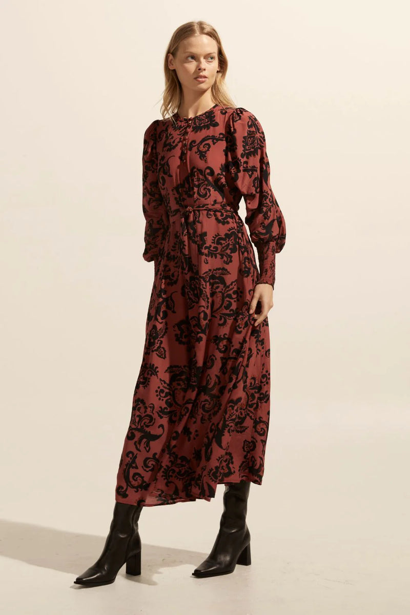 The Tangent offers an elegant option for autumnal dressing. Crafted in our custom print ochre floral it takes its starting point from vintage aesthetics but translates as both modern and wearable. A rounded neckline has delicate covered buttons and a gathered shoulder seam lead into a dramatic gathered feature sleeve that finishes neatly in a deep shirred cuff.&nbsp; Zoe Kratzmann clay floral