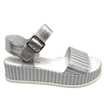 Elevate you casual style! When you need to be dressed but still want the comfort a flat shoe gives then these metallic sandals are perfect. The striped silver leather of the soft wide strap across the toe is repeated in the platform and the Y back is in plain silver leather. Made by Django and Juliette.