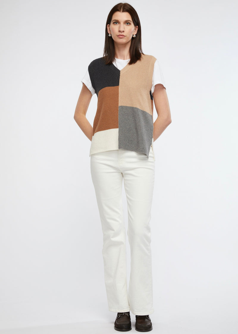 Our Geometric V-Neck Vest is a versatile piece that effortlessly complements your unique style. Designed for a relaxed silhouette, the loose fit ensures a comfortable and flattering look. Side splits further enhance the vest's easygoing vibe while allowing for effortless movement.