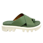 Fligh is a modern toe thong slide on a white chunky "tractor tyre" sole. The soft leather crosses the foot in wide straps and has a toe piece. This comfortable summer slide is available in the beautiful green shade of basil. Made by EOS.