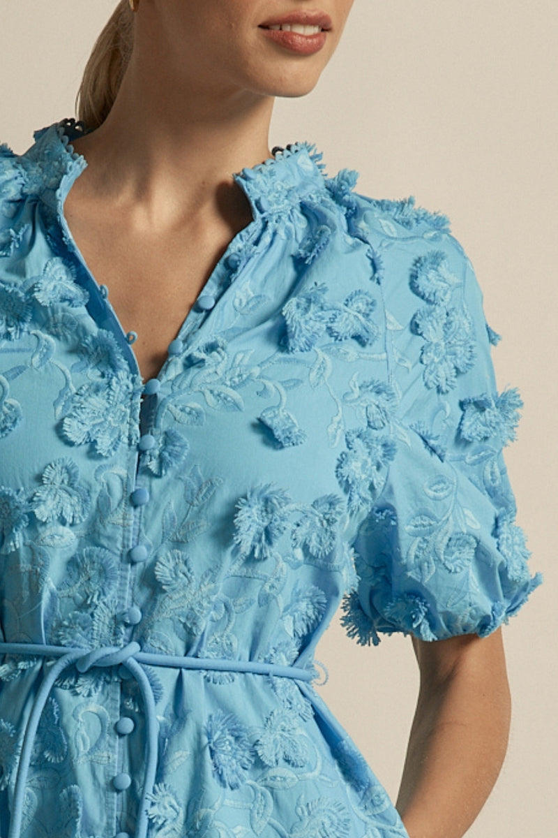 crafted in cotton, the aspect dress combines a dynamic 3D floral broderie with a scalloped lace neckline finish. A piece designed for elevated and romantic summer dressing.

100% cotton, trims: 100% polyester 
Covered buttons running from neckline to hem
Fabric covered belt with brass ends for versatile styling options 
Elbow length raglan sleeve 
3d floral broderie finish adds a sense of feminine charm 
Mini-length finishing mid-thigh