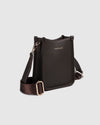The Louenhide Parker Phone Crossbody Bag effortlessly combines an elevated aesthetic with everyday functionality. Whether you're heading to the office, running errands or meeting friends for coffee, this minimalistic phone bag will be your new go-to. Parker features an on-trend and modern silhouette, enhanced by the contrasting stitch details in three classic colour ways. Elevate your style with the sateen webbing guitar strap or keep it simple with the matching vegan leather crossbody strap. Keeping your e