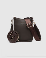 The Louenhide Parker Phone Crossbody Bag effortlessly combines an elevated aesthetic with everyday functionality. Whether you're heading to the office, running errands or meeting friends for coffee, this minimalistic phone bag will be your new go-to. Parker features an on-trend and modern silhouette, enhanced by the contrasting stitch details in three classic colour ways. Elevate your style with the sateen webbing guitar strap or keep it simple with the matching vegan leather crossbody strap. Keeping your e