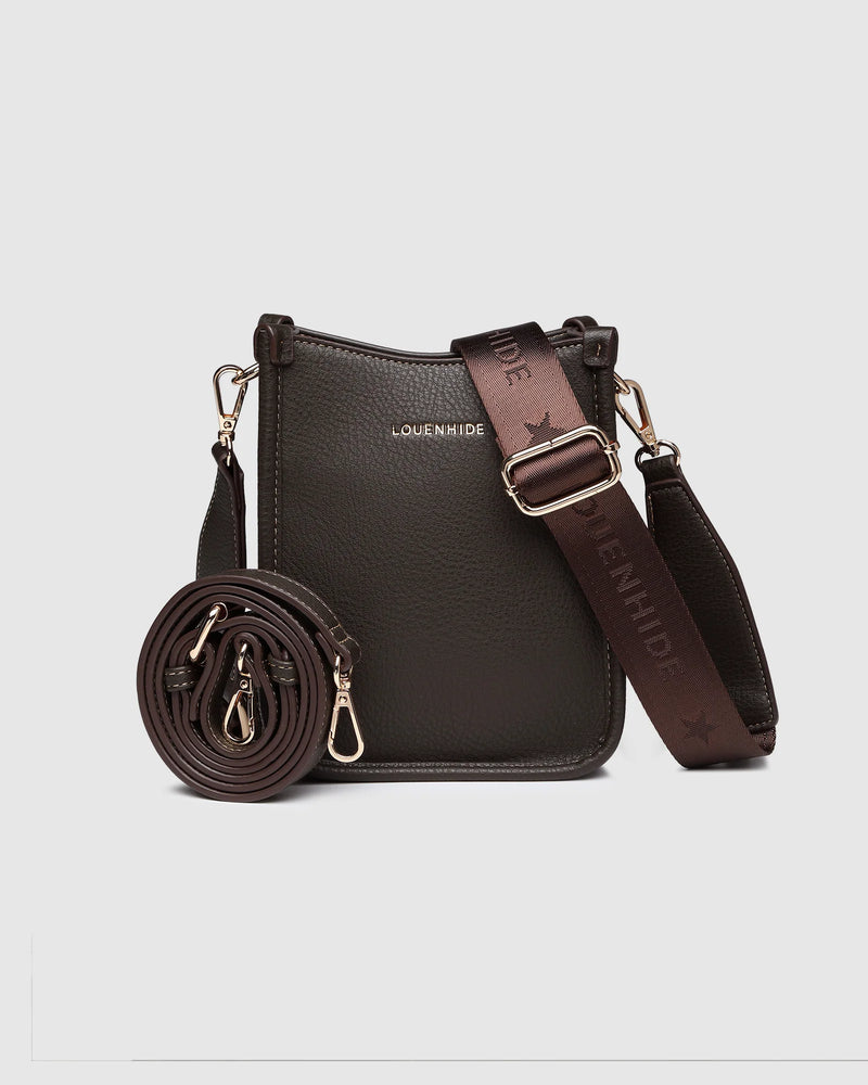 The Louenhide Parker Phone Crossbody Bag effortlessly combines an elevated aesthetic with everyday functionality. Whether you're heading to the office, running errands or meeting friends for coffee, this minimalistic phone bag will be your new go-to. Parker features an on-trend and modern silhouette, enhanced by the contrasting stitch details in three classic colour ways. Elevate your style with the sateen webbing guitar strap or keep it simple with the matching vegan leather crossbody strap. Keeping your e