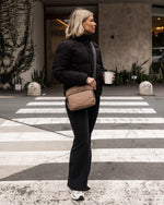 nternal Features	Zip Pocket, Slip Pocket
External Features	Front Side Zip Pocket, Back Side Zip Pocket
Internal Lining	Polyester Recycled Black and White Stripe Logo 100% Lining
Crossbody Strap	Adjustable and Detachable 80-145cm Sateen Strap
Closure	Secure Zip
Body Material	Satin Finish Polyurethane 100%
Hardware	Black
Dimensions	W23 x H19 x D9cm
Weight	0.55kg

