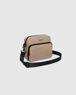 nternal Features	Zip Pocket, Slip Pocket
External Features	Front Side Zip Pocket, Back Side Zip Pocket
Internal Lining	Polyester Recycled Black and White Stripe Logo 100% Lining
Crossbody Strap	Adjustable and Detachable 80-145cm Sateen Strap
Closure	Secure Zip
Body Material	Satin Finish Polyurethane 100%
Hardware	Black
Dimensions	W23 x H19 x D9cm
Weight	0.55kg
