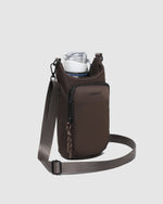 The Louenhide Miami Water Bottle Bag is a sleek, hands-free essential for an active, on-the-go lifestyle. With its slim, modern silhouette, this nylon water bottle crossbody bag is designed for effortless movement while keeping your water bottle secure and within reach (yes, it will even fit a 1L Frank Green!). Not just for hydration, the Miami features a convenient compartment to secure your phone and keys – so you’re ready to tackle the day without the bulk. Whether you’re heading out for a morning walk, 