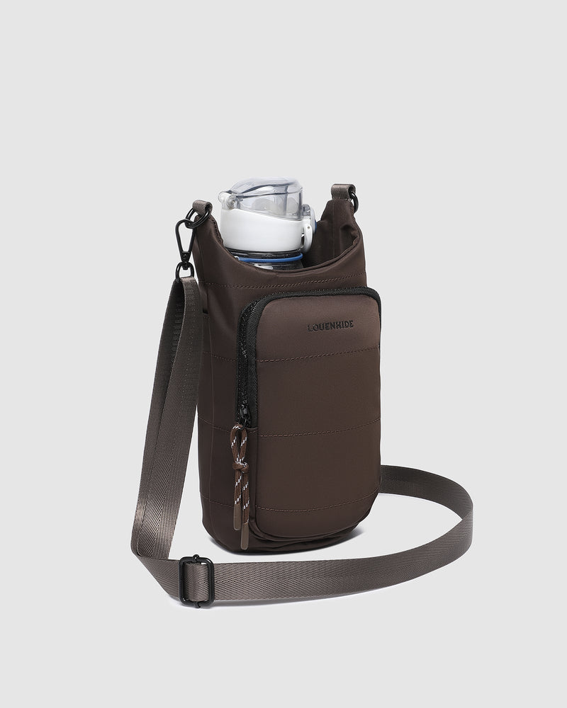 The Louenhide Miami Water Bottle Bag is a sleek, hands-free essential for an active, on-the-go lifestyle. With its slim, modern silhouette, this nylon water bottle crossbody bag is designed for effortless movement while keeping your water bottle secure and within reach (yes, it will even fit a 1L Frank Green!). Not just for hydration, the Miami features a convenient compartment to secure your phone and keys – so you’re ready to tackle the day without the bulk. Whether you’re heading out for a morning walk, 