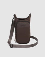 The Louenhide Miami Water Bottle Bag is a sleek, hands-free essential for an active, on-the-go lifestyle. With its slim, modern silhouette, this nylon water bottle crossbody bag is designed for effortless movement while keeping your water bottle secure and within reach (yes, it will even fit a 1L Frank Green!). Not just for hydration, the Miami features a convenient compartment to secure your phone and keys – so you’re ready to tackle the day without the bulk. Whether you’re heading out for a morning walk, 