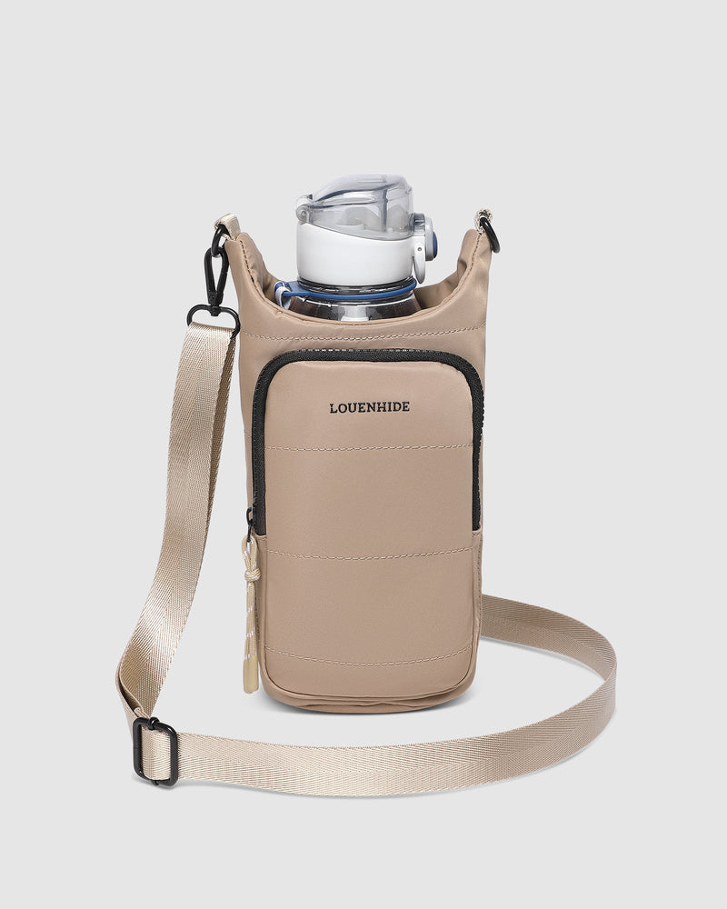 The Louenhide Miami Water Bottle Bag is a sleek, hands-free essential for an active, on-the-go lifestyle. With its slim, modern silhouette, this nylon water bottle crossbody bag is designed for effortless movement while keeping your water bottle secure and within reach (yes, it will even fit a 1L Frank Green!). Not just for hydration, the Miami features a convenient compartment to secure your phone and keys – so you’re ready to tackle the day without the bulk. Whether you’re heading out for a morning walk, 