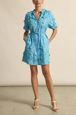 crafted in cotton, the aspect dress combines a dynamic 3D floral broderie with a scalloped lace neckline finish. A piece designed for elevated and romantic summer dressing.

100% cotton, trims: 100% polyester 
Covered buttons running from neckline to hem
Fabric covered belt with brass ends for versatile styling options 
Elbow length raglan sleeve 
3d floral broderie finish adds a sense of feminine charm 
Mini-length finishing mid-thigh