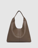 The Louenhide Avery Mocha Shoulder Bag is a modern take on the classic hobo bag with an elevated twist. The whipstitch detailing adds depth and texture to the shoulder bags exterior while the slouchy, minimalistic design adds a soft yet sleek element to your capsule wardrobe. The seamless teardrop silhouette sits comfortably over the shoulder, while offering ample interior space to fit your everyday essentials and more. With its timeless blend of structure and softness, elevate your everyday with the Avery 