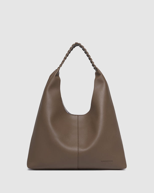 The Louenhide Avery Mocha Shoulder Bag is a modern take on the classic hobo bag with an elevated twist. The whipstitch detailing adds depth and texture to the shoulder bags exterior while the slouchy, minimalistic design adds a soft yet sleek element to your capsule wardrobe. The seamless teardrop silhouette sits comfortably over the shoulder, while offering ample interior space to fit your everyday essentials and more. With its timeless blend of structure and softness, elevate your everyday with the Avery 