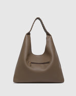 The Louenhide Avery Mocha Shoulder Bag is a modern take on the classic hobo bag with an elevated twist. The whipstitch detailing adds depth and texture to the shoulder bags exterior while the slouchy, minimalistic design adds a soft yet sleek element to your capsule wardrobe. The seamless teardrop silhouette sits comfortably over the shoulder, while offering ample interior space to fit your everyday essentials and more. With its timeless blend of structure and softness, elevate your everyday with the Avery 
