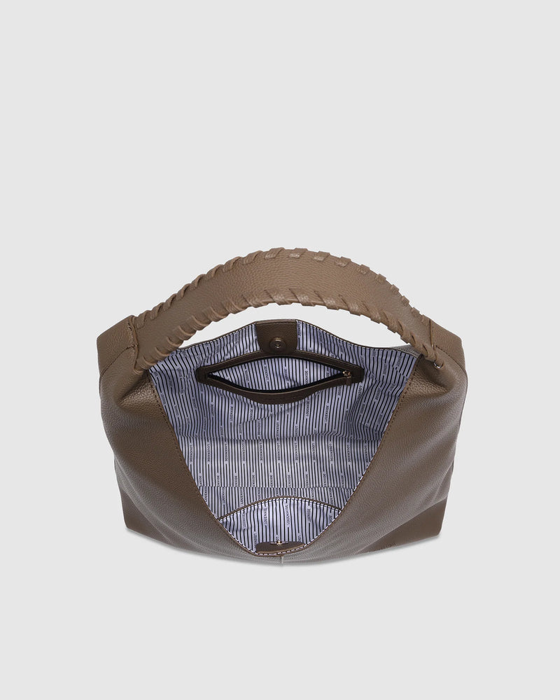 The Louenhide Avery Mocha Shoulder Bag is a modern take on the classic hobo bag with an elevated twist. The whipstitch detailing adds depth and texture to the shoulder bags exterior while the slouchy, minimalistic design adds a soft yet sleek element to your capsule wardrobe. The seamless teardrop silhouette sits comfortably over the shoulder, while offering ample interior space to fit your everyday essentials and more. With its timeless blend of structure and softness, elevate your everyday with the Avery 