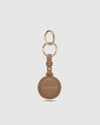 The Opal Mocha AirTag Case is a refined travel essential designed to bring both elegance and ease to your journey. Designed in a smooth vegan leather, Opal Mocha securely holds your Apple AirTag with a sleek press-stud closure, keeping your valuables traceable without compromising on style. Whether clipped to your handbag, keyring, or slipped inside your suitcase, Opal Mocha’s compact silhouette and easy-clip ring make her a subtle yet sophisticated addition to your travel routine. Lightweight, minimal, and