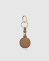 The Opal Mocha AirTag Case is a refined travel essential designed to bring both elegance and ease to your journey. Designed in a smooth vegan leather, Opal Mocha securely holds your Apple AirTag with a sleek press-stud closure, keeping your valuables traceable without compromising on style. Whether clipped to your handbag, keyring, or slipped inside your suitcase, Opal Mocha’s compact silhouette and easy-clip ring make her a subtle yet sophisticated addition to your travel routine. Lightweight, minimal, and