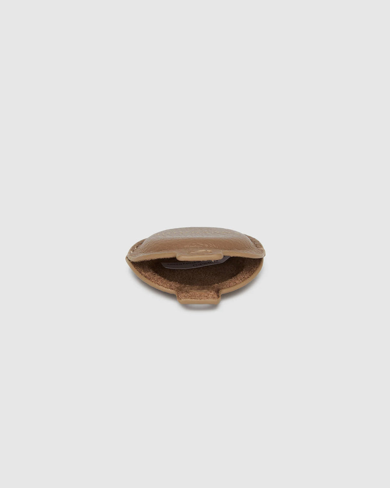 The Opal Mocha AirTag Case is a refined travel essential designed to bring both elegance and ease to your journey. Designed in a smooth vegan leather, Opal Mocha securely holds your Apple AirTag with a sleek press-stud closure, keeping your valuables traceable without compromising on style. Whether clipped to your handbag, keyring, or slipped inside your suitcase, Opal Mocha’s compact silhouette and easy-clip ring make her a subtle yet sophisticated addition to your travel routine. Lightweight, minimal, and