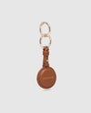 The Opal Mocha AirTag Case is a refined travel essential designed to bring both elegance and ease to your journey. Designed in a smooth vegan leather, Opal Mocha securely holds your Apple AirTag with a sleek press-stud closure, keeping your valuables traceable without compromising on style. Whether clipped to your handbag, keyring, or slipped inside your suitcase, Opal Mocha’s compact silhouette and easy-clip ring make her a subtle yet sophisticated addition to your travel routine. Lightweight, minimal, and