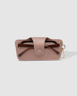 The Louenhide Skittle Sunglass Case is the perfect blend of style and functionality for your everyday eyewear. For ultimate convenience, effortlessly attach to your keys or handbag with the light gold hardware keyring clasp. Without compromising on style, the exterior features a gorgeous vegan leather, while the interior is lined with soft suede material to keep your everyday eyewear protected. Whether it's your favourite sunglasses or your reading glasses, they will stay protected and safe with the secure 