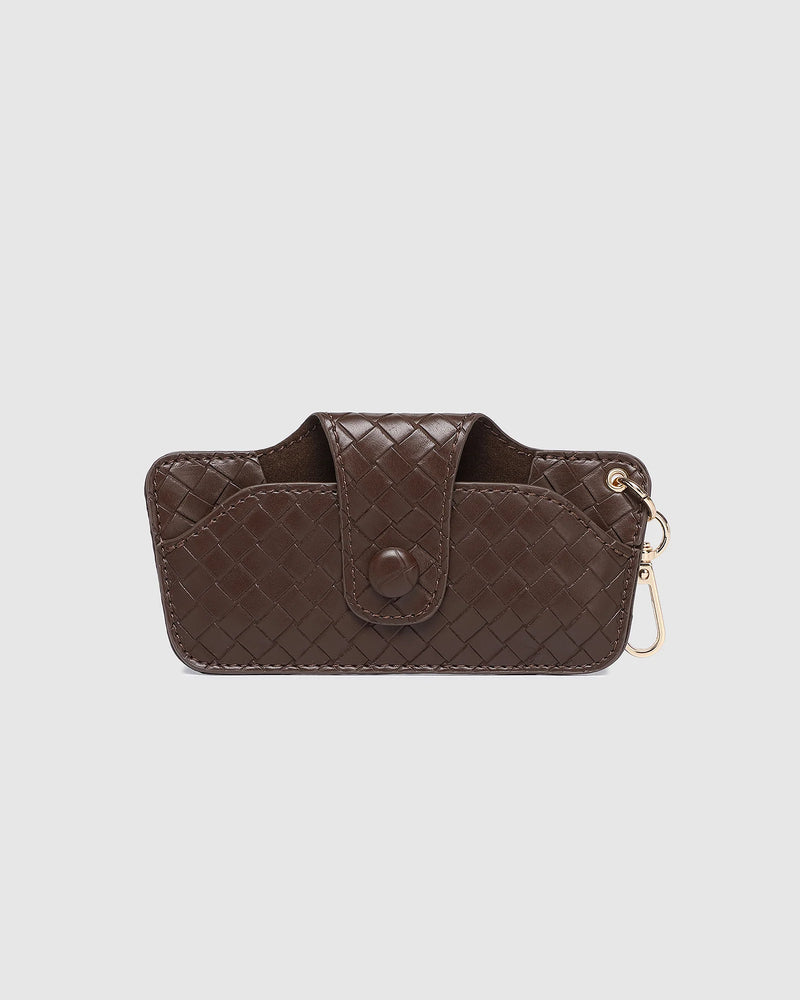 The Louenhide Skittle Sunglass Case is the perfect blend of style and functionality for your everyday eyewear. For ultimate convenience, effortlessly attach to your keys or handbag with the light gold hardware keyring clasp. Without compromising on style, the exterior features a gorgeous vegan leather, while the interior is lined with soft suede material to keep your everyday eyewear protected. Whether it's your favourite sunglasses or your reading glasses, they will stay protected and safe with the secure 