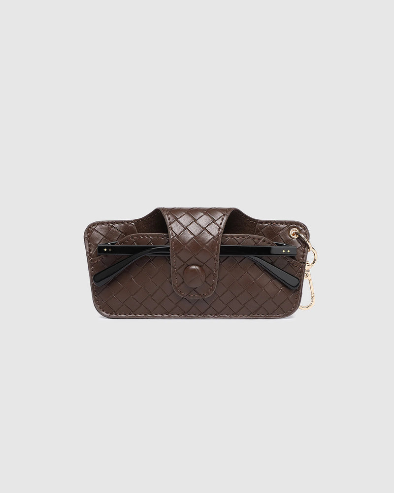 The Louenhide Skittle Sunglass Case is the perfect blend of style and functionality for your everyday eyewear. For ultimate convenience, effortlessly attach to your keys or handbag with the light gold hardware keyring clasp. Without compromising on style, the exterior features a gorgeous vegan leather, while the interior is lined with soft suede material to keep your everyday eyewear protected. Whether it's your favourite sunglasses or your reading glasses, they will stay protected and safe with the secure 