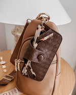 The Louenhide Skittle Sunglass Case is the perfect blend of style and functionality for your everyday eyewear. For ultimate convenience, effortlessly attach to your keys or handbag with the light gold hardware keyring clasp. Without compromising on style, the exterior features a gorgeous vegan leather, while the interior is lined with soft suede material to keep your everyday eyewear protected. Whether it's your favourite sunglasses or your reading glasses, they will stay protected and safe with the secure 