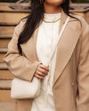 Internal Features	Zip Pocket, Slip Pocket
Internal Lining	Polyester Recycled Beige and White Stripe Logo 100% Lining
Crossbody Strap	Adjustable and Detachable 69-133cm Logo Webbing Strap
PU Strap	Adjustable and Detachable 110-124cm Vegan Leather Strap
Closure	Secure Zip
Body Material	Polyurethane Vegan Leather 100%
Hardware	Light Gold
Dimensions	W23 x H13 x D5cm
Weight	0.8kg
