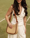 nternal Features	Zip Pocket, Slip Pocket
Internal Lining	Polyester Recycled Beige and White Stripe Logo 100% Lining
Shoulder Strap	Adjustable and Non-Detachable 63-145cm Shoulder Strap
Closure	Secure Zip
Body Material	Raffia 100%
Hardware	Light Gold
Dimensions	W22 x H19.5 x D11cm
Weight	0.562kg
