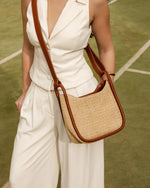nternal Features	Zip Pocket, Slip Pocket
Internal Lining	Polyester Recycled Beige and White Stripe Logo 100% Lining
Shoulder Strap	Adjustable and Non-Detachable 63-145cm Shoulder Strap
Closure	Secure Zip
Body Material	Raffia 100%
Hardware	Light Gold
Dimensions	W22 x H19.5 x D11cm
Weight	0.562kg
