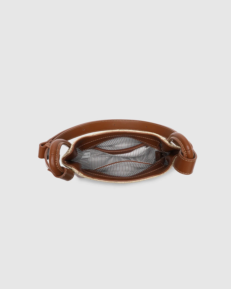 nternal Features	Zip Pocket, Slip Pocket
Internal Lining	Polyester Recycled Beige and White Stripe Logo 100% Lining
Shoulder Strap	Adjustable and Non-Detachable 63-145cm Shoulder Strap
Closure	Secure Zip
Body Material	Raffia 100%
Hardware	Light Gold
Dimensions	W22 x H19.5 x D11cm
Weight	0.562kg
