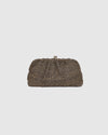 he Goldie Raffia Vanilla Clutch is your statement plus-one for any occasion, designed to elevate your look from daytime celebrations to evening soirées. This evening clutch features a slouchy yet structured silhouette, crafted in a raffia-like texture for a modern take on timeless texture. As a true gold chain clutch, Goldie Raffia Vanilla is finished with both a short and long gold chain strap, giving you the freedom to wear her in hand, over the shoulder, or crossbody. A polished kiss clip closure keeps y