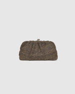 he Goldie Raffia Vanilla Clutch is your statement plus-one for any occasion, designed to elevate your look from daytime celebrations to evening soirées. This evening clutch features a slouchy yet structured silhouette, crafted in a raffia-like texture for a modern take on timeless texture. As a true gold chain clutch, Goldie Raffia Vanilla is finished with both a short and long gold chain strap, giving you the freedom to wear her in hand, over the shoulder, or crossbody. A polished kiss clip closure keeps y