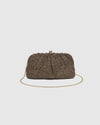 he Goldie Raffia Vanilla Clutch is your statement plus-one for any occasion, designed to elevate your look from daytime celebrations to evening soirées. This evening clutch features a slouchy yet structured silhouette, crafted in a raffia-like texture for a modern take on timeless texture. As a true gold chain clutch, Goldie Raffia Vanilla is finished with both a short and long gold chain strap, giving you the freedom to wear her in hand, over the shoulder, or crossbody. A polished kiss clip closure keeps y