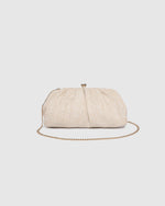 he Goldie Raffia Vanilla Clutch is your statement plus-one for any occasion, designed to elevate your look from daytime celebrations to evening soirées. This evening clutch features a slouchy yet structured silhouette, crafted in a raffia-like texture for a modern take on timeless texture. As a true gold chain clutch, Goldie Raffia Vanilla is finished with both a short and long gold chain strap, giving you the freedom to wear her in hand, over the shoulder, or crossbody. A polished kiss clip closure keeps y