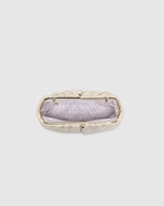he Goldie Raffia Vanilla Clutch is your statement plus-one for any occasion, designed to elevate your look from daytime celebrations to evening soirées. This evening clutch features a slouchy yet structured silhouette, crafted in a raffia-like texture for a modern take on timeless texture. As a true gold chain clutch, Goldie Raffia Vanilla is finished with both a short and long gold chain strap, giving you the freedom to wear her in hand, over the shoulder, or crossbody. A polished kiss clip closure keeps y