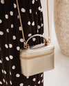 Internal Lining	Polyester Recycled Beige and White Stripe Logo 100% Lining
Handle Height	7cm
Shoulder Strap	Detachable 110cm Chain Strap
Crossbody Strap	Adjustable and Detachable 106-124.5cm Vegan Leather Strap
Closure	Secure Zip
Body Material	Polyurethane Vegan Leather 100%
Hardware	Light Gold
Dimensions	W17.3 x H12 x D6.5cm
Weight	0.35kg