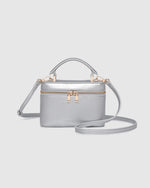 Internal Lining	Polyester Recycled Beige and White Stripe Logo 100% Lining
Handle Height	7cm
Shoulder Strap	Detachable 110cm Chain Strap
Crossbody Strap	Adjustable and Detachable 106-124.5cm Vegan Leather Strap
Closure	Secure Zip
Body Material	Polyurethane Vegan Leather 100%
Hardware	Light Gold
Dimensions	W17.3 x H12 x D6.5cm
Weight	0.35kg