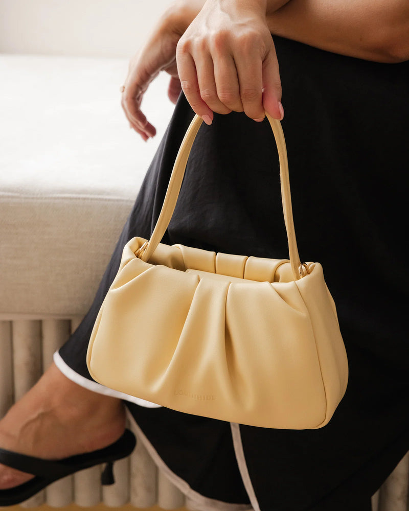 Internal Lining	Polyester Recycled Beige and White Stripe Logo 100% Lining
Handle Height	15-20cm
Shoulder Strap	Detachable 109.5cm Chain Strap
Closure	Magnetic Clasp
Body Material	Polyurethane Vegan Leather 100%
Hardware	Light Gold
Dimensions	W23.5 x H12 x D7cm
Weight	0.28kg