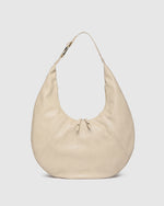 Internal Features	Zip Pocket, Slip Pocket
Internal Lining	Polyester Recycled Black and White Stripe Logo 100% Lining
Handle Height	34cm
Closure	Secure Zip
Body Material	Polyurethane Vegan Leather 100%
Hardware	Light Gold
Dimensions	W47 x H27 x D1cm (expands to 23cm deep)
Weight	0.45kg
