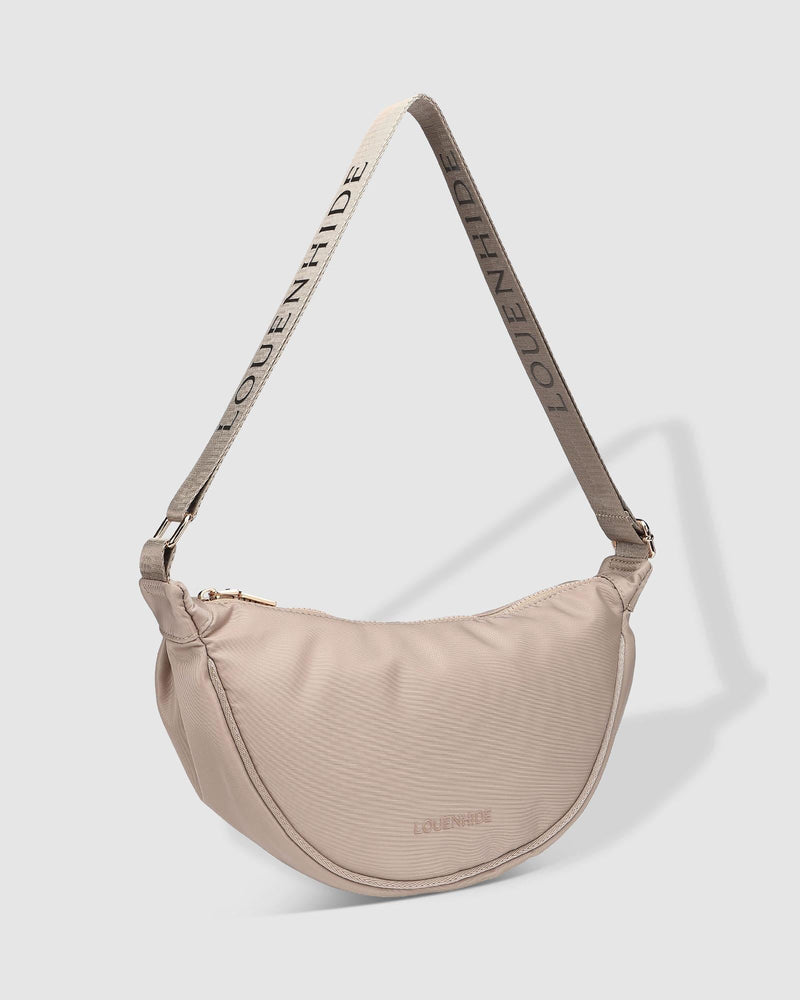 Internal Features	2 Slip Pockets
Internal Lining	Polyester Recycled Black and White Stripe 100% Lining
Guitar Strap	Adjustable and Non-Detachable 34-65cm Logo Guitar Strap
Closure	Secure Zip
Body Material	Nylon 100%
Hardware	Light Gold
Dimensions	W29 x H15.5 x D10cm
Weight	0.3kg