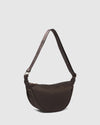 Internal Features	2 Slip Pockets
Internal Lining	Polyester Recycled Black and White Stripe 100% Lining
Guitar Strap	Adjustable and Non-Detachable 34-65cm Logo Guitar Strap
Closure	Secure Zip
Body Material	Nylon 100%
Hardware	Light Gold
Dimensions	W29 x H15.5 x D10cm
Weight	0.3kg