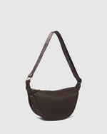 Internal Features	2 Slip Pockets
Internal Lining	Polyester Recycled Black and White Stripe 100% Lining
Guitar Strap	Adjustable and Non-Detachable 34-65cm Logo Guitar Strap
Closure	Secure Zip
Body Material	Nylon 100%
Hardware	Light Gold
Dimensions	W29 x H15.5 x D10cm
Weight	0.3kg