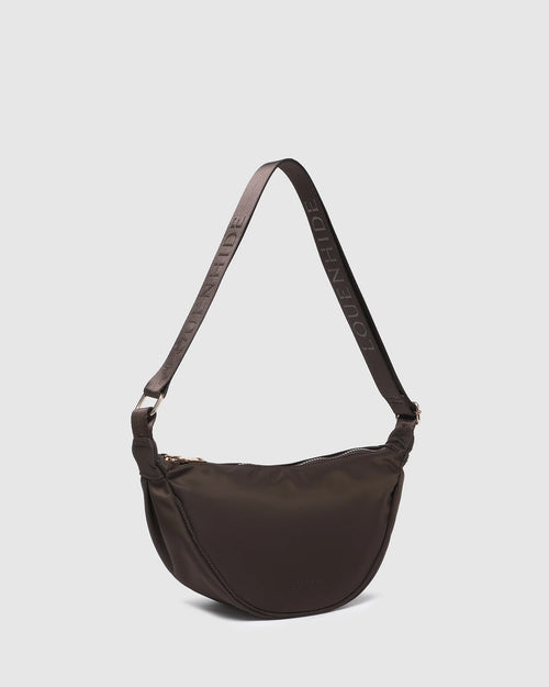 Internal Features	2 Slip Pockets
Internal Lining	Polyester Recycled Black and White Stripe 100% Lining
Guitar Strap	Adjustable and Non-Detachable 34-65cm Logo Guitar Strap
Closure	Secure Zip
Body Material	Nylon 100%
Hardware	Light Gold
Dimensions	W29 x H15.5 x D10cm
Weight	0.3kg